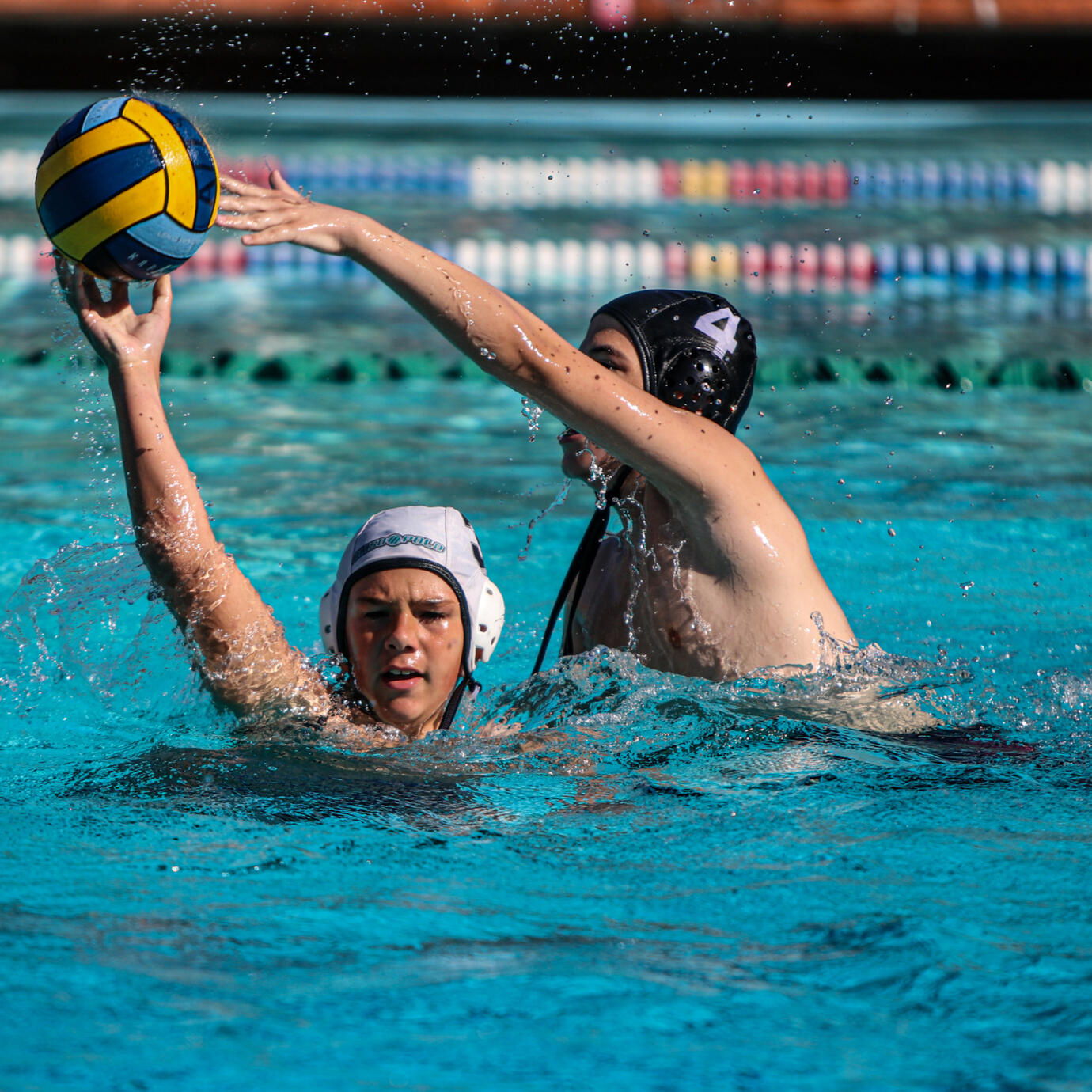 Exciting water polo moment with players engaged in a tough match.