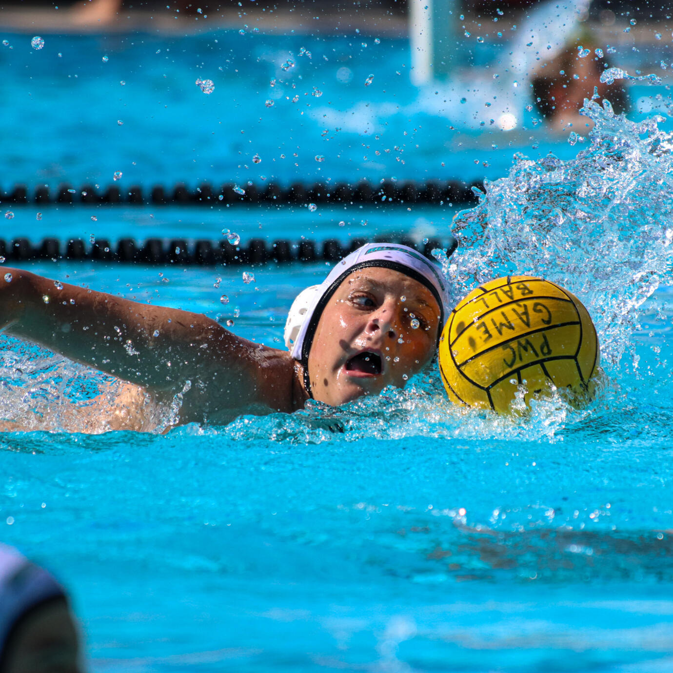Water polo team attacking the goal in a high-stakes game.
