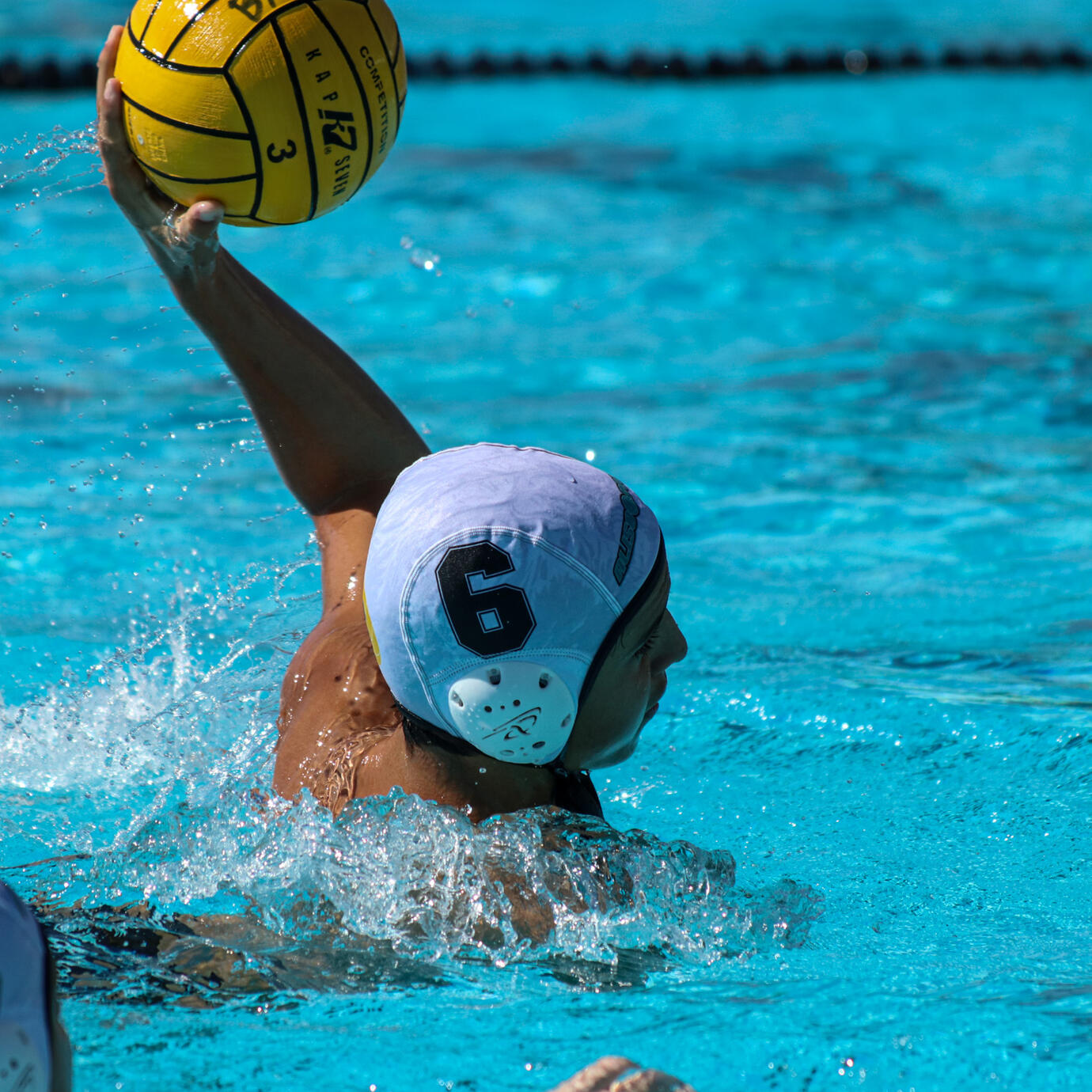 Action-packed water polo shot capturing the intensity of the sport.