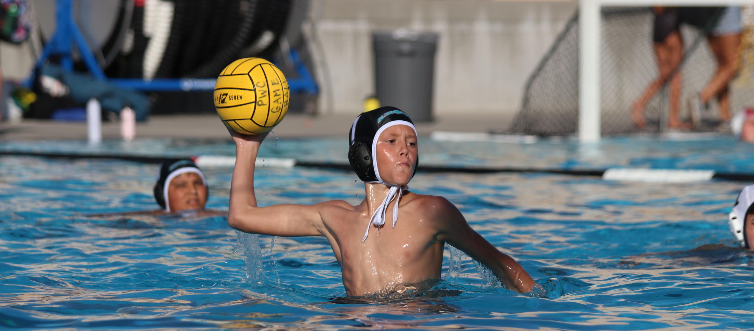 High-intensity water polo play with players in fierce competition.